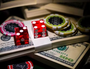 craps dice, money, and casino chips